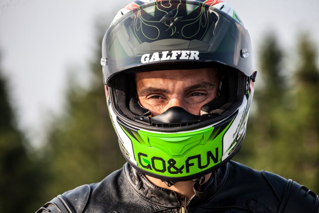 Race driver wearing a helmet and safety gear